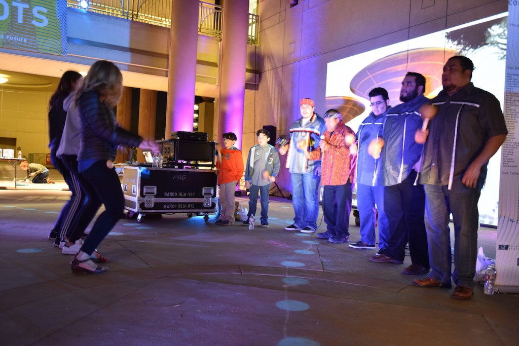 Noli Ortega, Tomiear Ortega, Ray Rivera, Ceremonial Leader Kim Marcus, Tribal Secretary Mark Villaseñor, Mike Villaseñor, Tribal President Rudy Ortega Jr. sing Bird Songs while members of the audience dance.